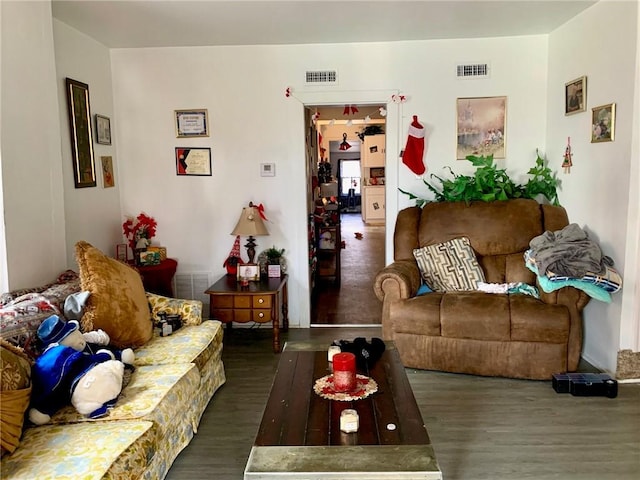 living room with dark hardwood / wood-style flooring