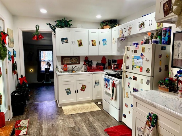 kitchen featuring white appliances, dark wood-type flooring, sink, light stone countertops, and white cabinetry