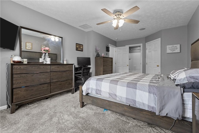 bedroom with light carpet, a textured ceiling, and ceiling fan