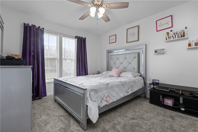 bedroom featuring ceiling fan and light carpet