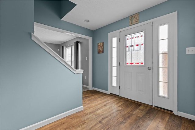 foyer entrance with wood-type flooring