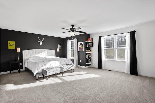 bedroom featuring ceiling fan and light colored carpet