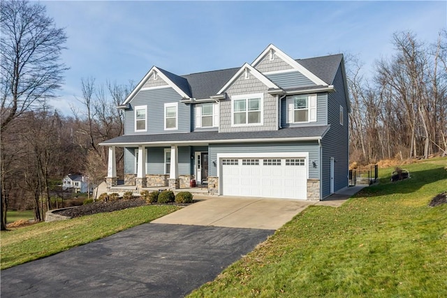 craftsman-style house with a front yard and a garage