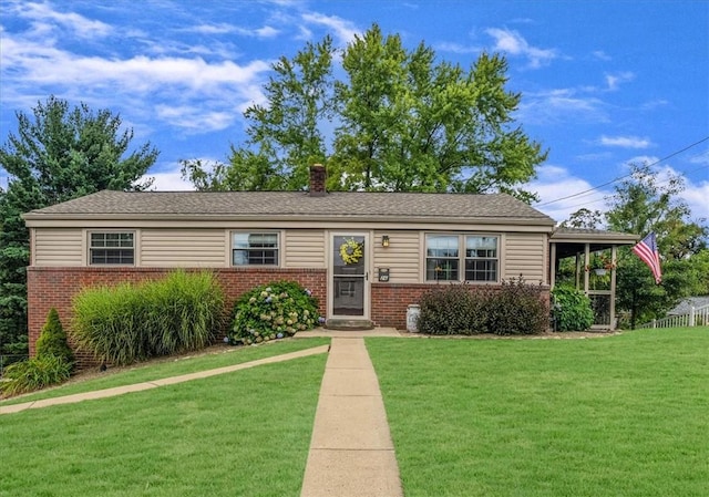 single story home with a front yard