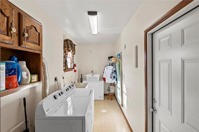 washroom with cabinets and independent washer and dryer