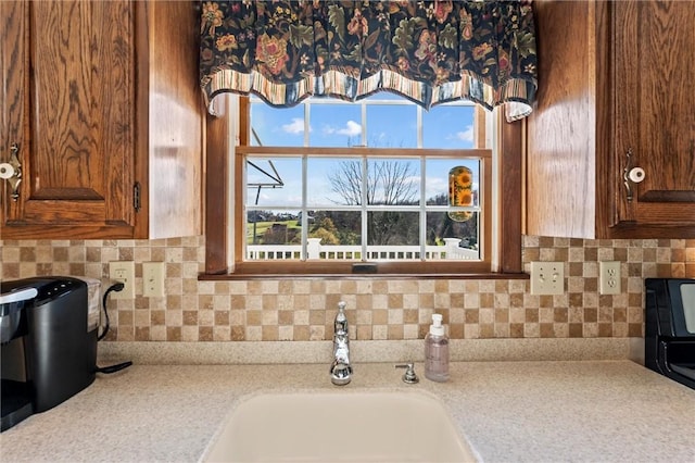 interior details with decorative backsplash and sink