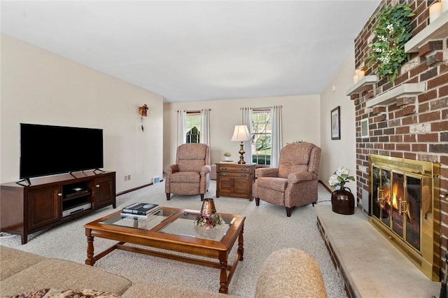 living room featuring light colored carpet and a brick fireplace