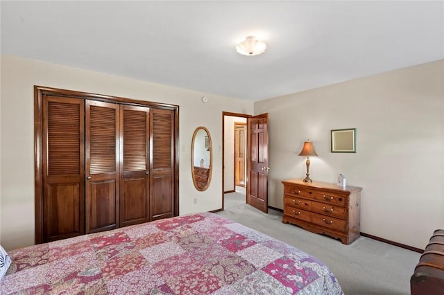 bedroom with light carpet and a closet