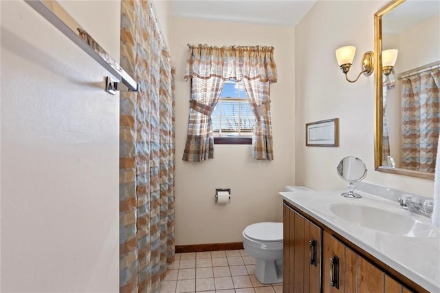 bathroom featuring tile patterned flooring, a shower with curtain, vanity, and toilet