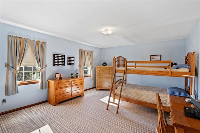 bedroom featuring light carpet