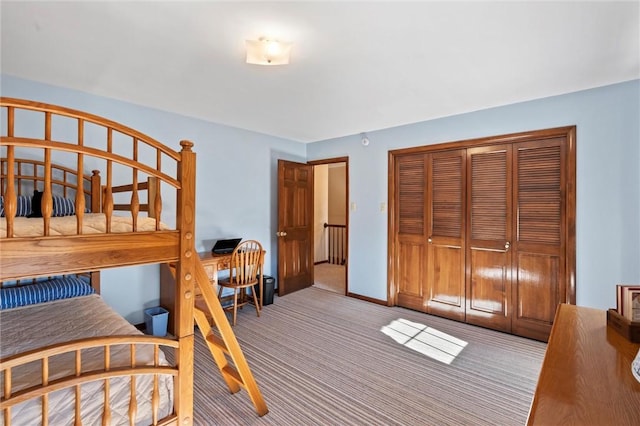 carpeted bedroom with a closet