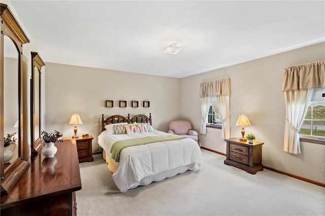 bedroom with light colored carpet