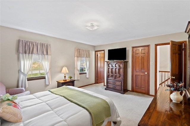 bedroom with light colored carpet