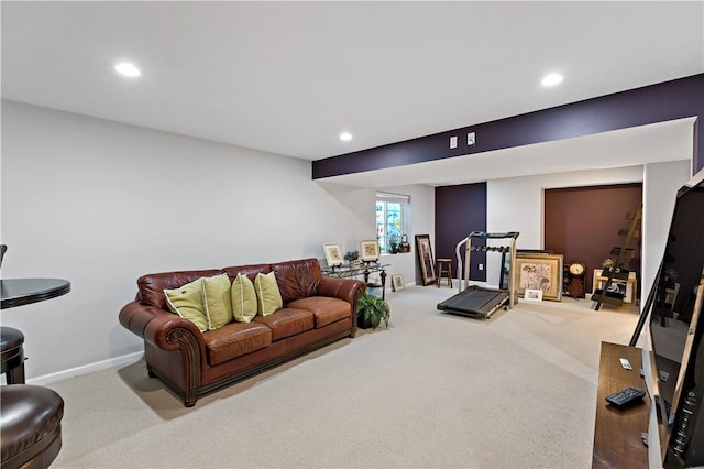 exercise room featuring light colored carpet