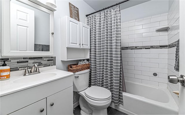 full bathroom featuring backsplash, vanity, shower / bath combo, and toilet