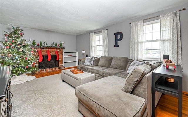 living room with hardwood / wood-style floors and a fireplace