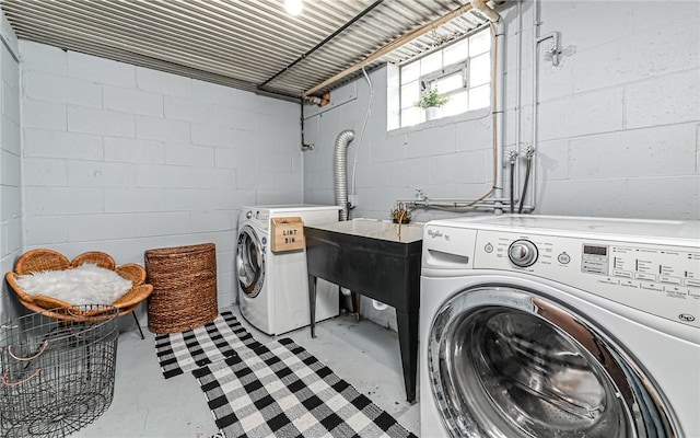 laundry room with washer and clothes dryer