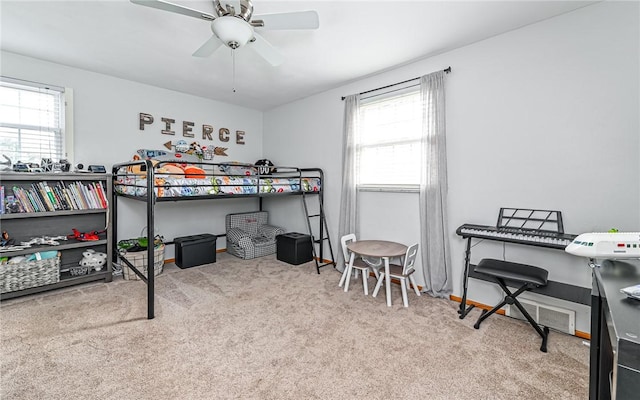 carpeted bedroom with ceiling fan