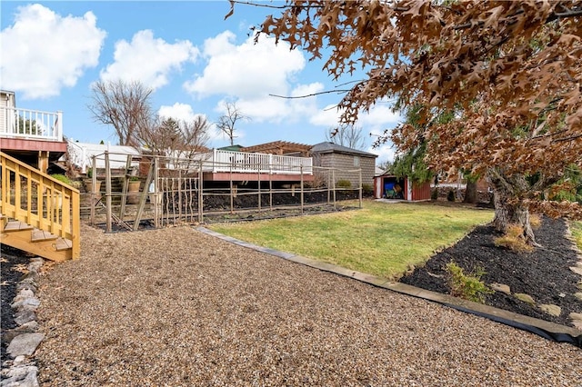 view of yard featuring an outbuilding and a deck