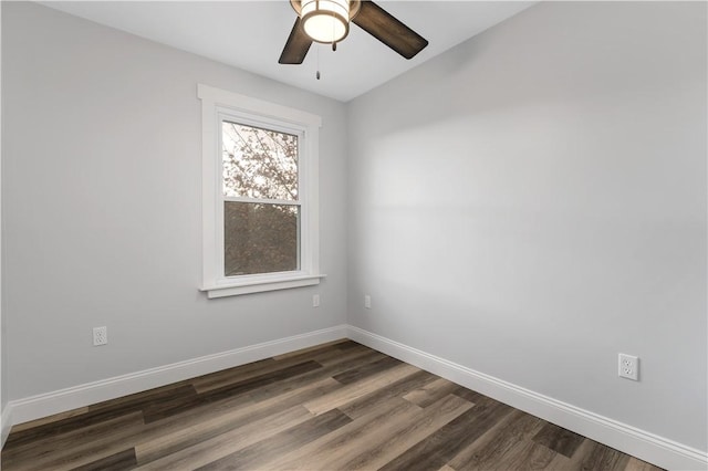 empty room with dark hardwood / wood-style floors and ceiling fan