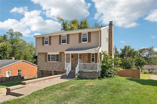 view of front of house featuring a front yard and a porch