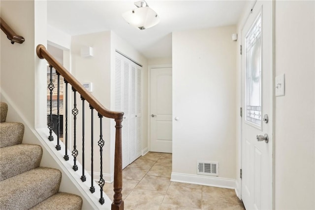 entryway featuring light tile patterned floors