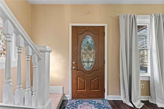 foyer with dark hardwood / wood-style floors