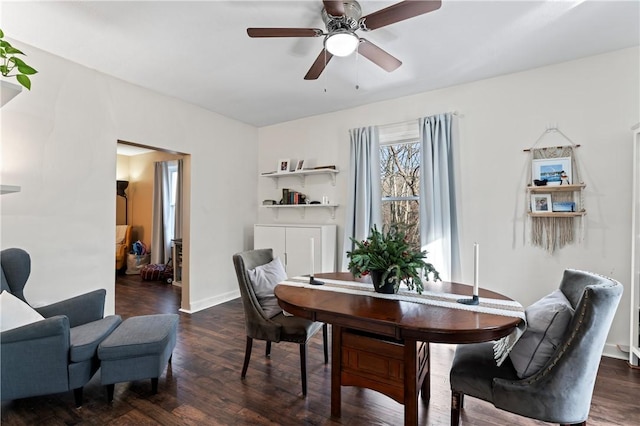 dining space with dark hardwood / wood-style flooring and ceiling fan