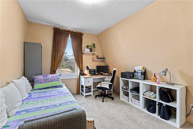 carpeted bedroom with vaulted ceiling