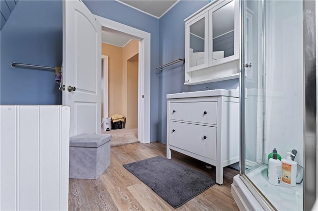 bathroom with hardwood / wood-style floors