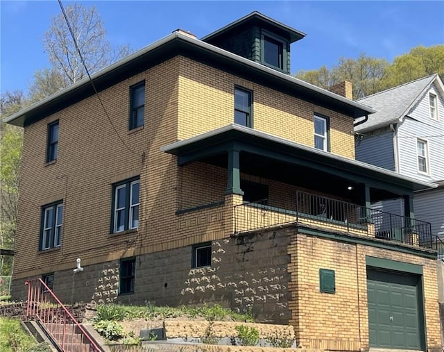 view of side of property featuring a garage