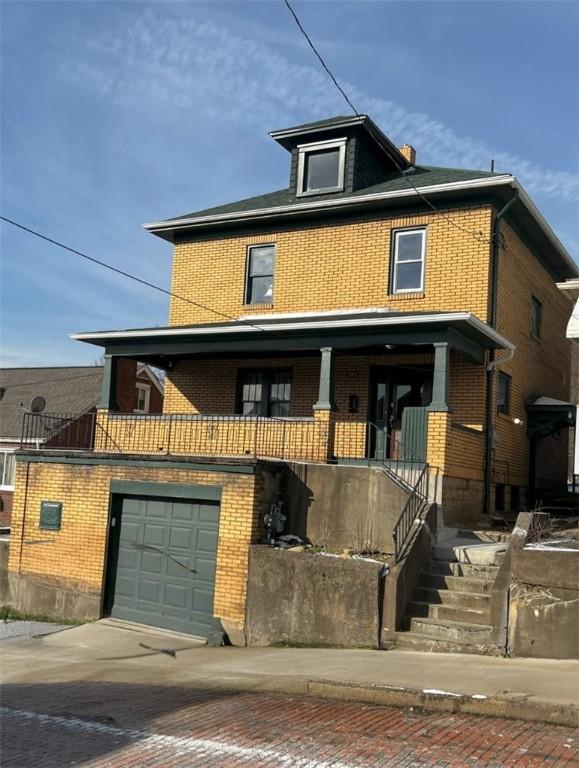 view of front of property with a garage