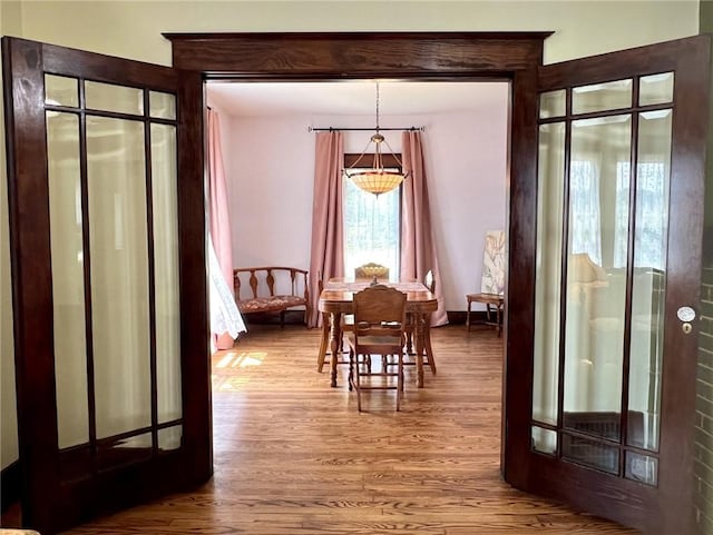 dining area with hardwood / wood-style floors