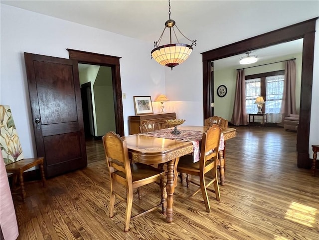 dining area with hardwood / wood-style flooring