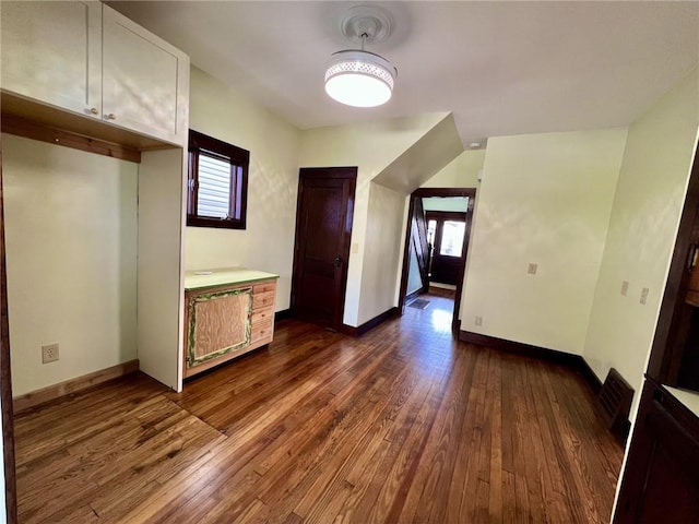 interior space with dark hardwood / wood-style flooring