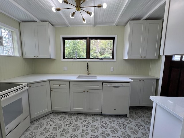 kitchen featuring white cabinets, a notable chandelier, white appliances, and sink