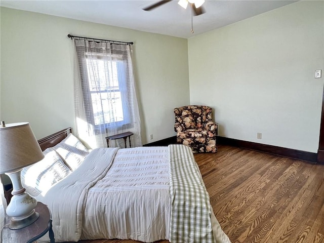 bedroom with wood-type flooring and ceiling fan