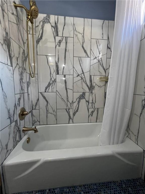 bathroom featuring shower / tub combo with curtain