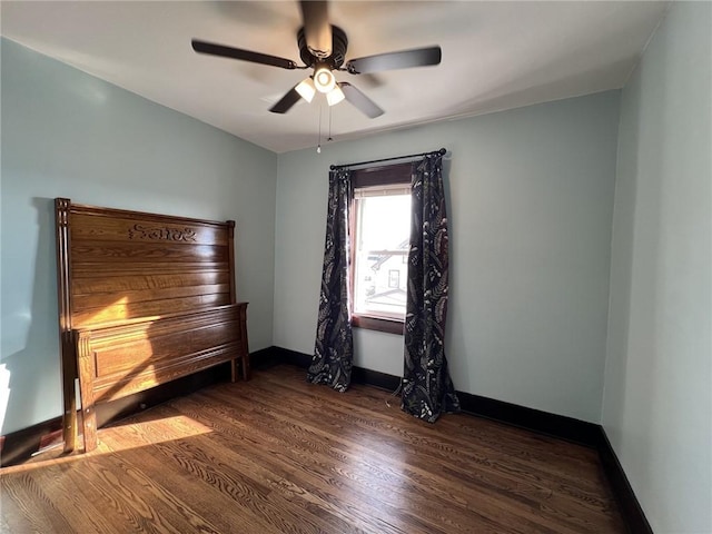 interior space featuring ceiling fan and dark hardwood / wood-style flooring