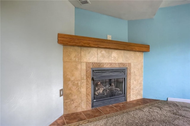 room details featuring a tiled fireplace