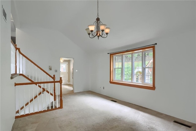 interior space featuring high vaulted ceiling, light colored carpet, a wealth of natural light, and a chandelier