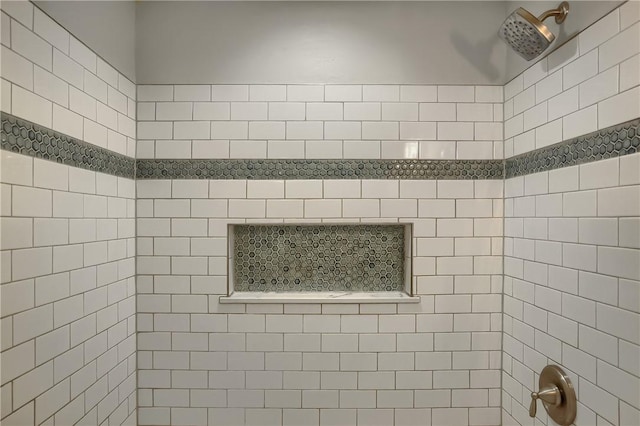 bathroom with a tile shower