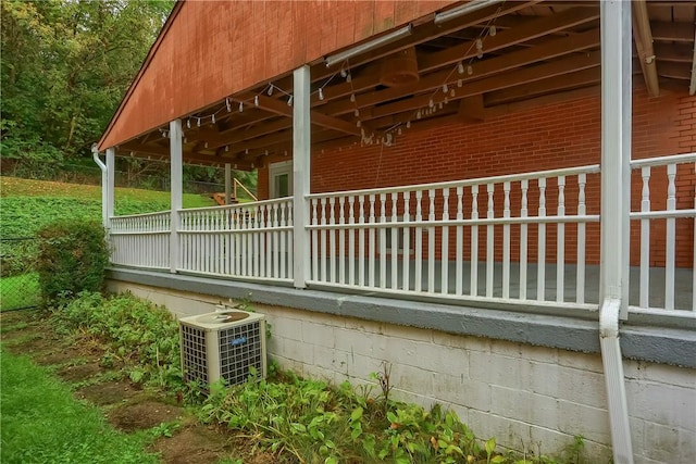 view of side of home featuring central AC