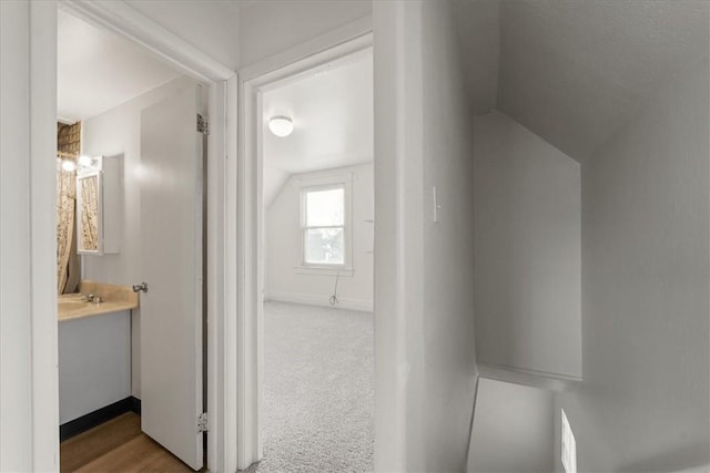 bathroom with vanity and vaulted ceiling