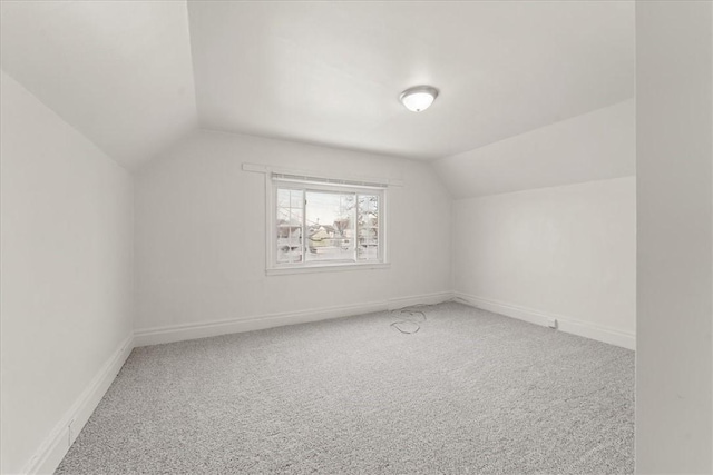 bonus room featuring carpet and lofted ceiling