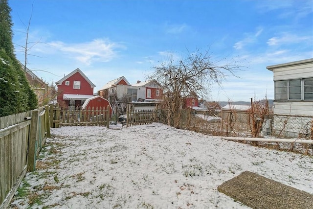 view of yard layered in snow