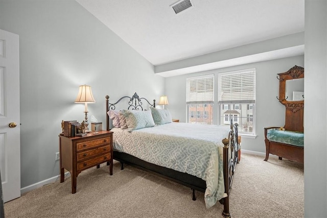 bedroom with carpet flooring and lofted ceiling