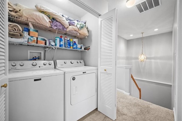 washroom with light carpet and independent washer and dryer