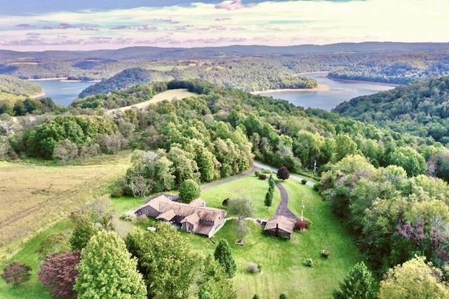 aerial view at dusk with a water view