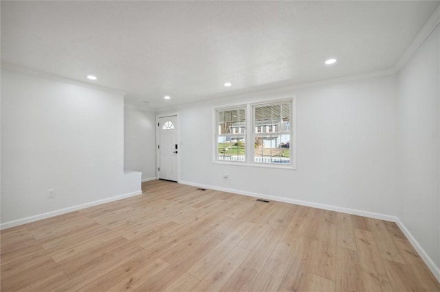 interior space featuring light hardwood / wood-style flooring and crown molding